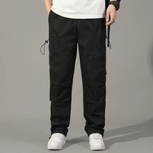 Cargar imagen en el visor de la galería, Pantalones: Estilo cargo. Moda coreana. Con múltiples bolsillos. Sueltos, rectos y con cordón ajustable. Varios colores sólidos.