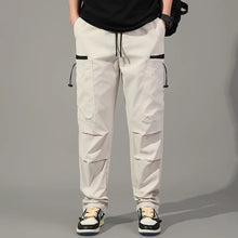 Cargar imagen en el visor de la galería, Pantalones: Estilo cargo. Moda coreana. Con múltiples bolsillos. Sueltos, rectos y con cordón ajustable. Varios colores sólidos.