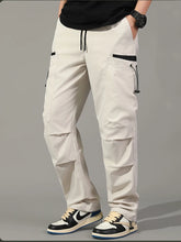 Cargar imagen en el visor de la galería, Pantalones: Estilo cargo. Moda coreana. Con múltiples bolsillos. Sueltos, rectos y con cordón ajustable. Varios colores sólidos.
