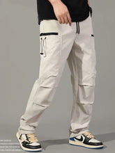 Cargar imagen en el visor de la galería, Pantalones: Estilo cargo. Moda coreana. Con múltiples bolsillos. Sueltos, rectos y con cordón ajustable. Varios colores sólidos.
